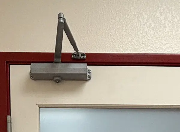 Commercial overhead door closer hardware installed by Mattlock locksmith in a Las Vegas business