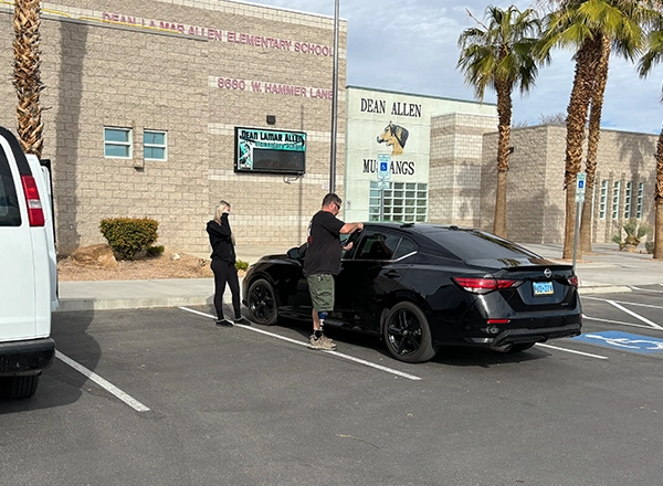 Mattlock locksmith providing emergency lockout assistance to a vehicle owner at a Las Vegas business
