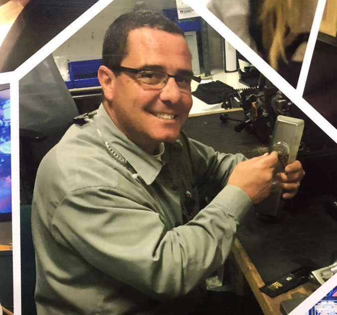 Mattlock commercial locksmith technician servicing a lock at a Las Vegas business workshop