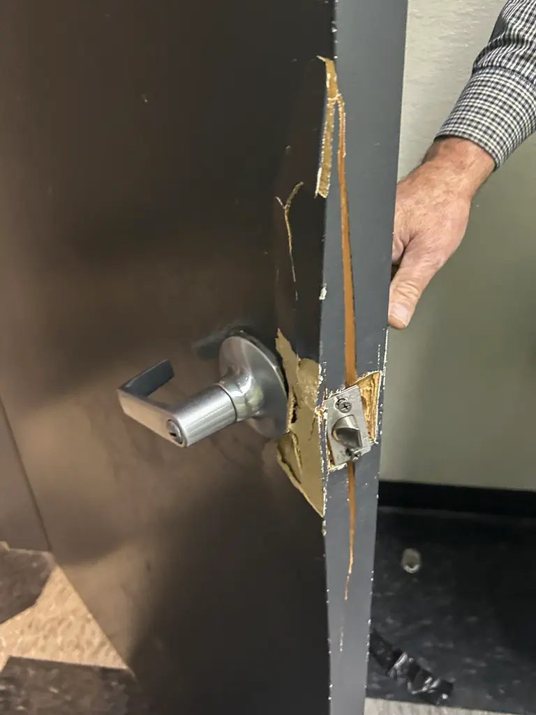 Damaged door lock before repair in Las Vegas